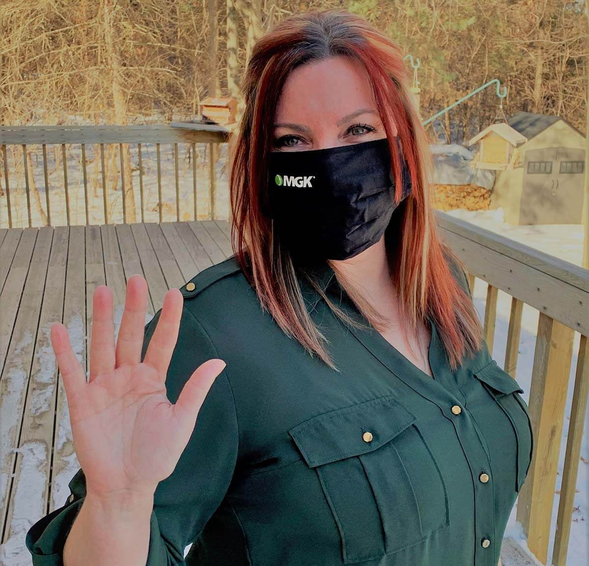 Lindsay Sillman - International Women's Day pose with hand up, wearing MGK branded mask