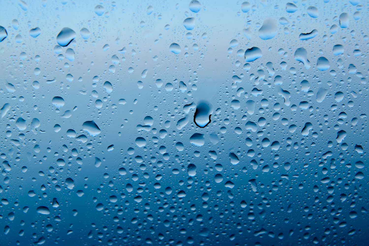 Droplet Size Blog - Droplets on blue background